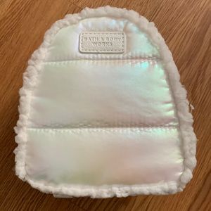 Super cute mini backpack. Iridescent color with faux fur trim. Brand new w/o tag